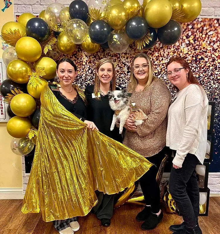 Smile, Facial Expression, Happy, Dress, Yellow, Fun, Fashion Design, Formal Wear, Leisure, Balloon, Event, Tradition, Party, Party Supply, Entertainment, Ceremony, Furry friends, Vintage Clothing, Gown