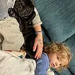 Dog, Comfort, Carnivore, Gesture, Toddler, Companion dog, Dog breed, Baby, Child, Linens, Lap, Sitting, Furry friends, Nap, Canidae, Sleep
