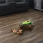 Couch, Wood, Toy, Wall, Table, Comfort, Hardwood, Grass, Road Surface, Laminate Flooring, Living Room, Wood Stain, Wood Flooring, Room, Stuffed Toy, Cabinetry, Varnish, Toy Vehicle