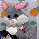 Photograph, White, Toy, Textile, Pink, Comfort, Snout, Easter Bunny, Stuffed Toy, Plush, Event, Furry friends, Mascot, Whiskers, Pattern, Sitting, Costume, Rabbit, Room, Fictional Character